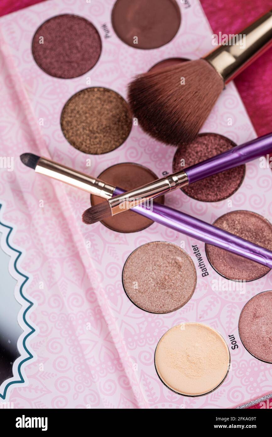palette of eyeshadow and make up brushes Stock Photo