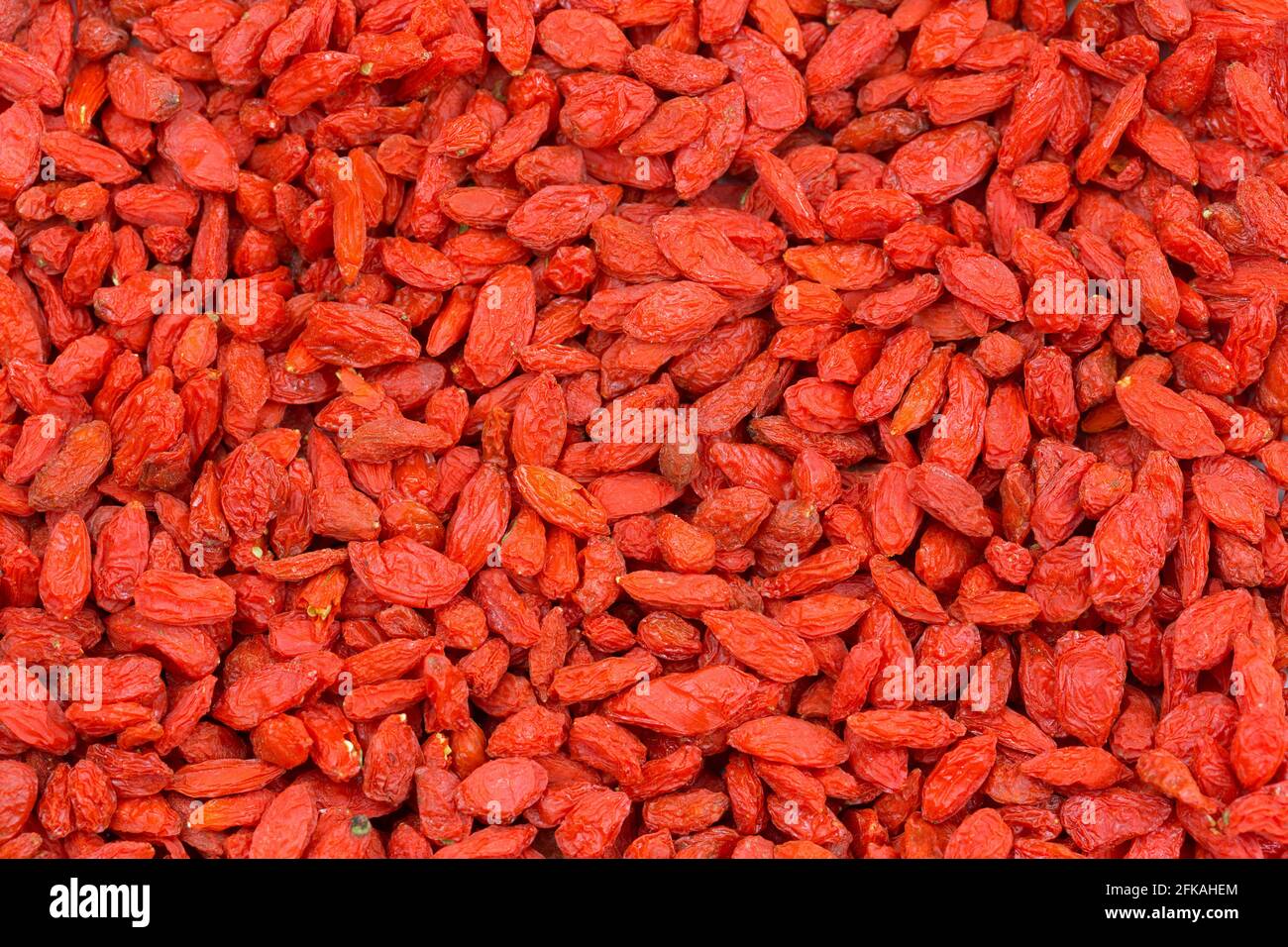 Closeup texture of dried red Goji berry, Wolfberry fruit (Lycium barbarum) used in traditional Chinese medicine Stock Photo