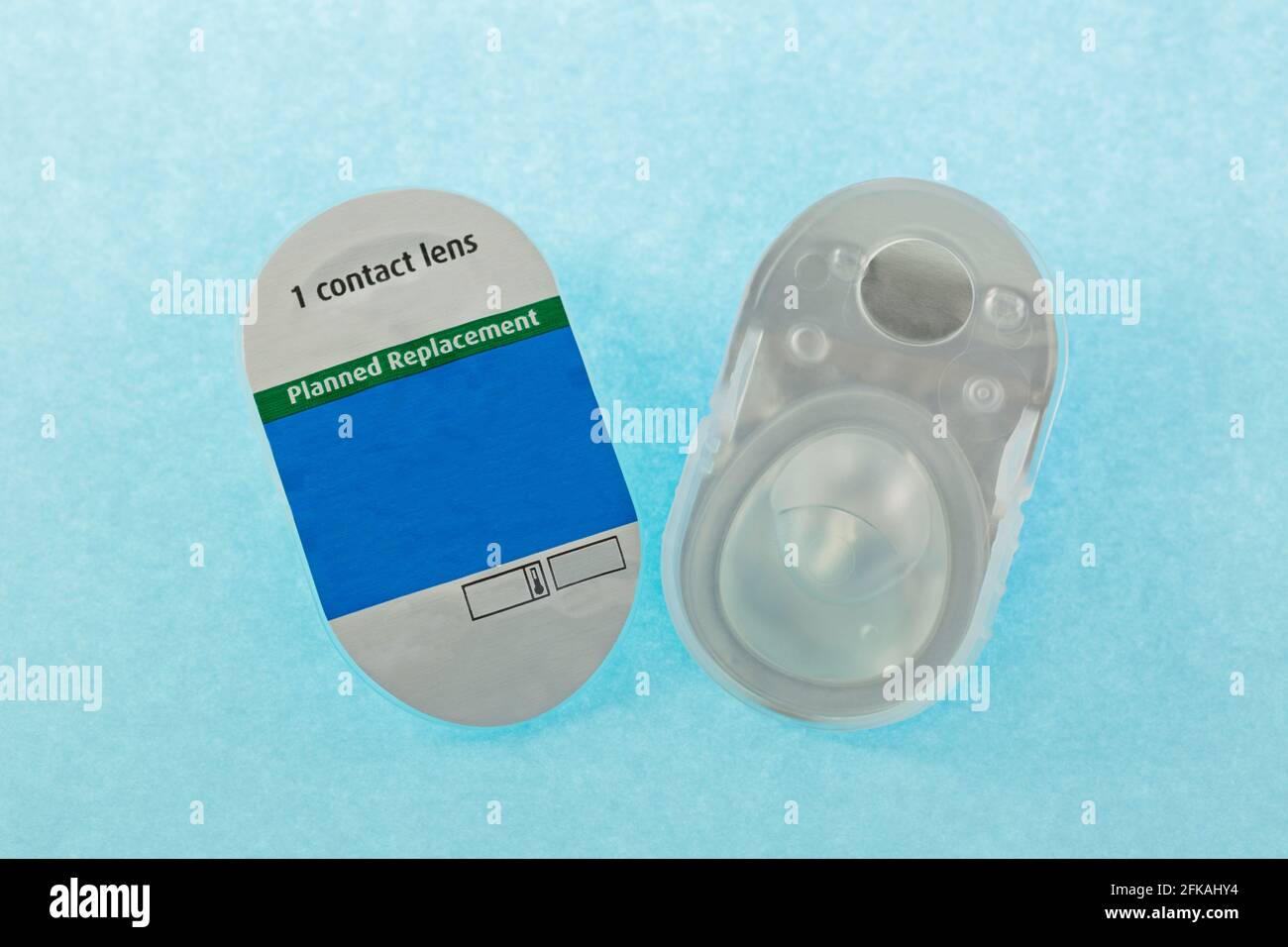 Contacts Package A pair of brand new monthly disposable contact lens packages on blue ...