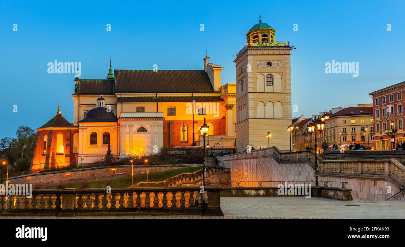Warsaw, Poland - April 28, 2021: Evening view of St. Anna academic church, kosciol Sw. Anny, at Krakowskie Przedmiescie street in Starowka Old Town Stock Photo