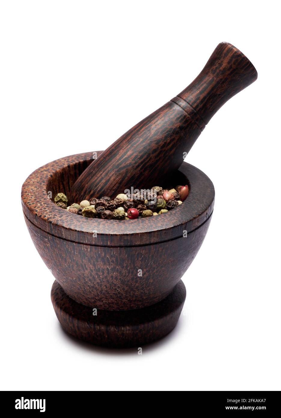 Modern wooden mortar with pepper spice and pestle isolated on white