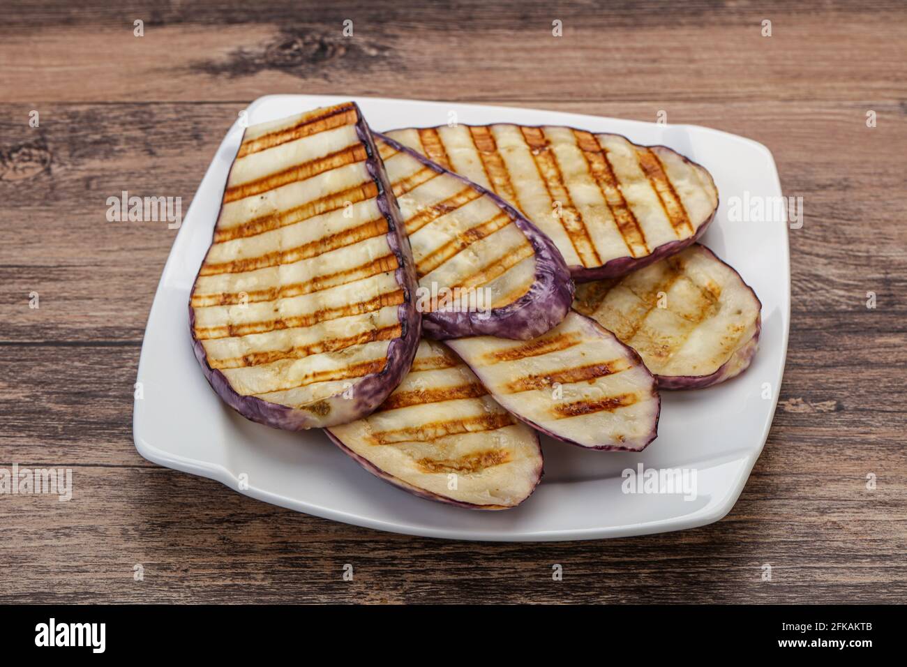 Grilled graffiti eggpant slices with olive oil Stock Photo Alamy