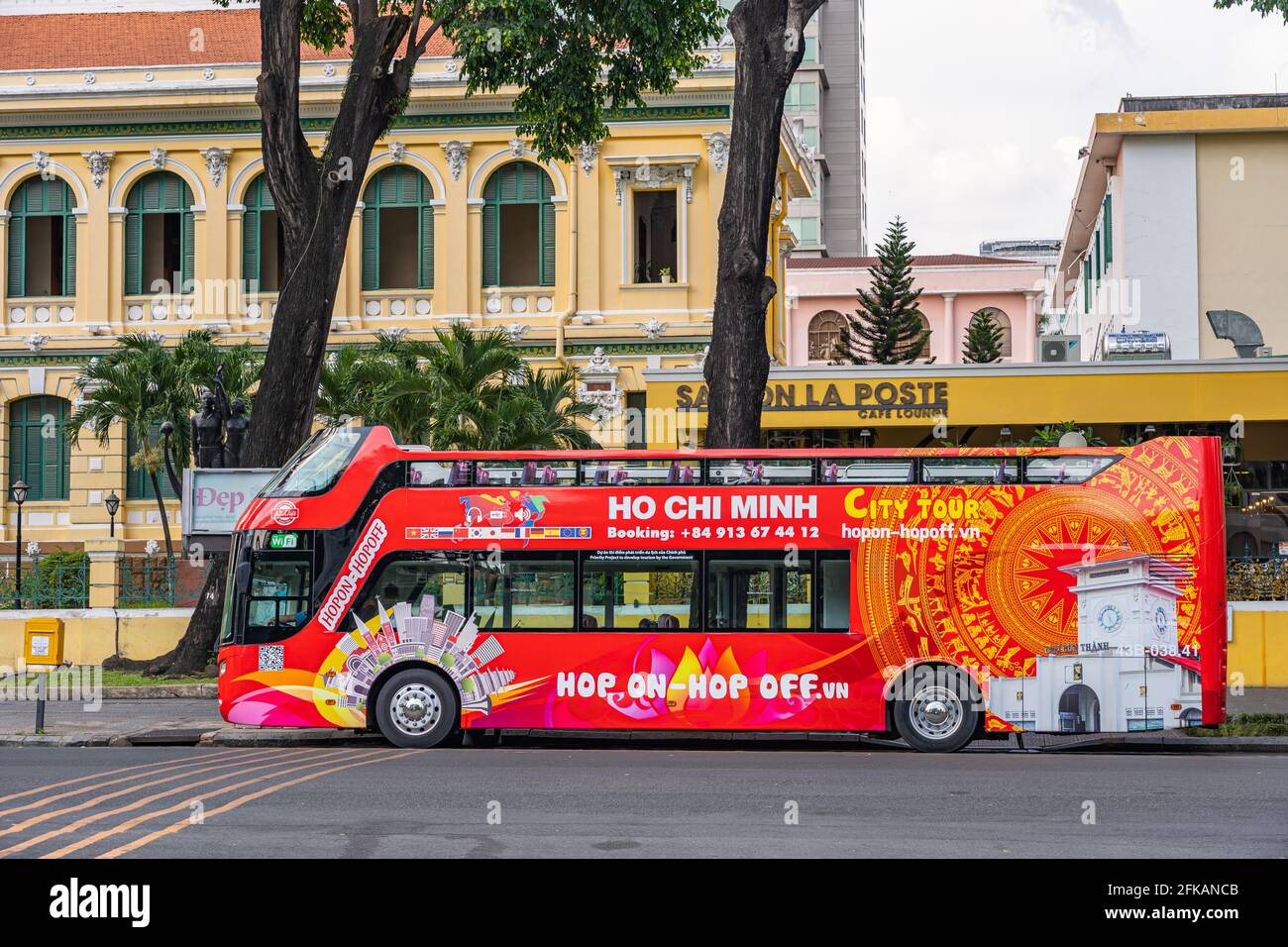 HO CHI MINH CITY, VIETNAM - April 26 2021: sightseeing double decker bus waiting for tourists Stock Photo