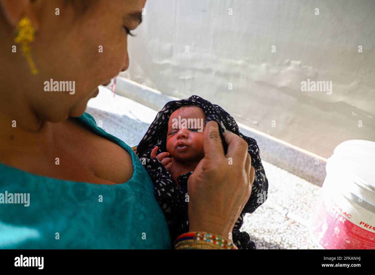 a mother bathing her new born baby. Stock Photo