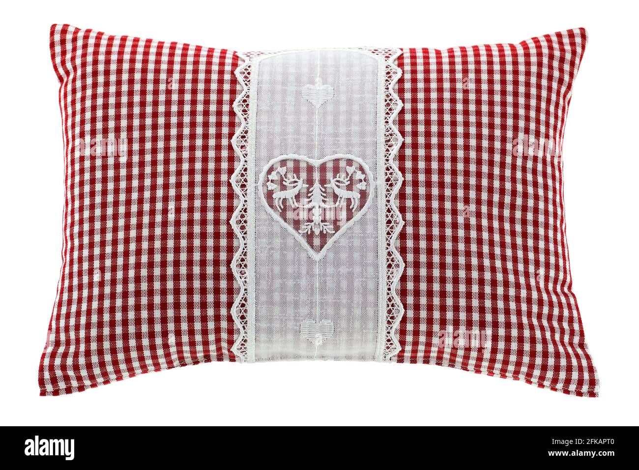 Closeup of a red gingham pillow with flake of Swiss stone pine inside, decorated with hand-made vintage crochet lace, isolated on white background Stock Photo
