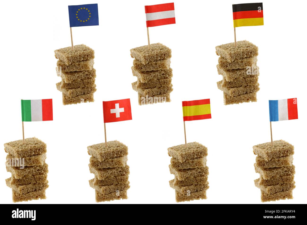 Different European flag toothpicks on Wholemeal, wholewheat brown bread Stock Photo