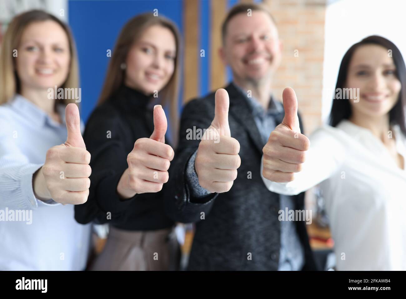 Group of business people showing thumbs up closeup Stock Photo - Alamy