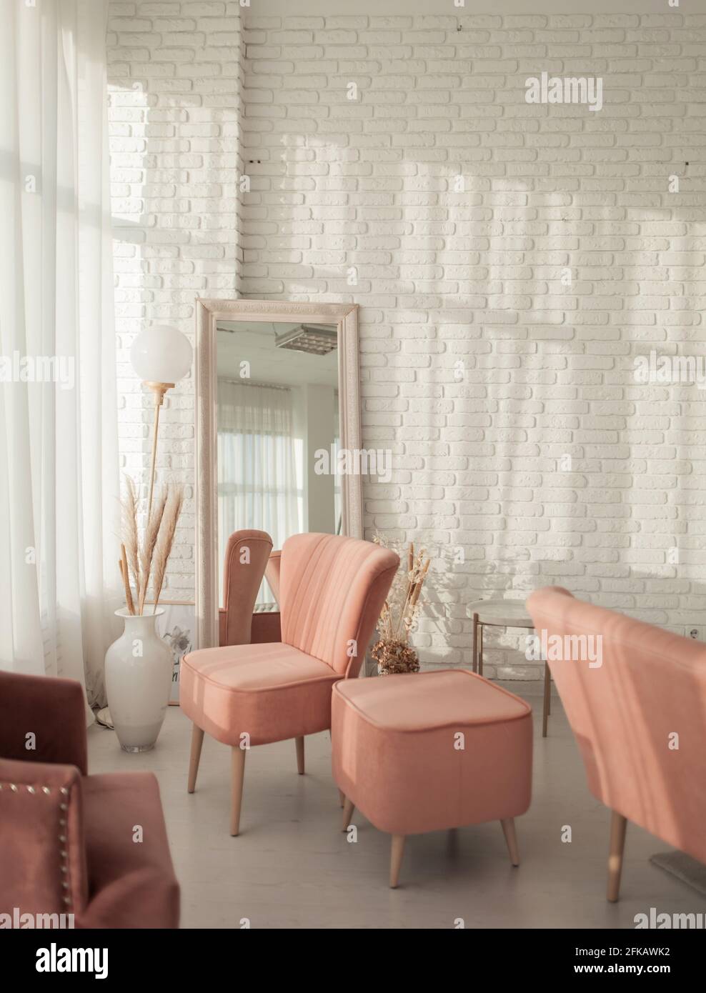 Living room with sofa, armchair, lamp and brick wall Stock Photo - Alamy
