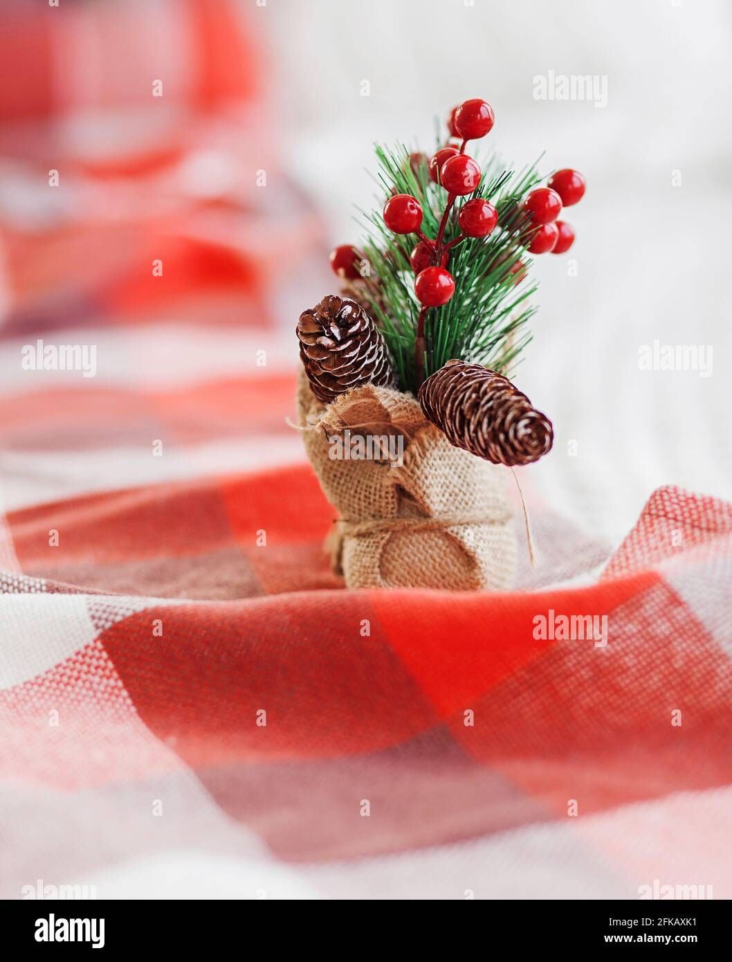 Christmas decorations with fir branches, red baubles, pine cones on ...