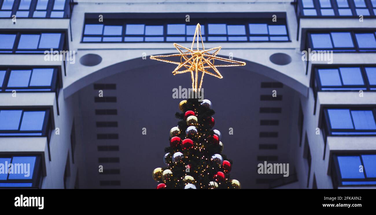 Christmas tree decoration. Christmas tree with shining star Stock Photo ...