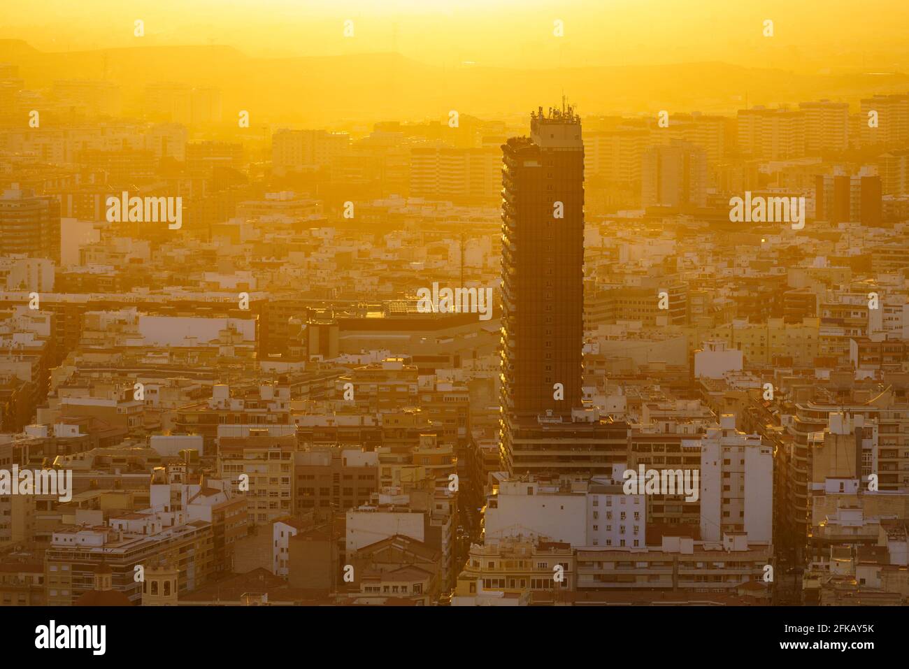 View of Alicante city by the end of the day. Urban landscape in orange. warm tones. Skyscraper Isolated Stock Photo