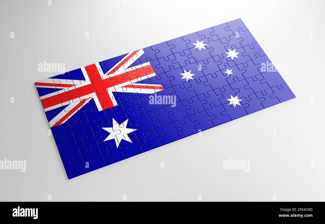 A jigsaw puzzle with a print of the flag of Heard Island and McDonald Islands, pieces of the puzzle isolated on white background. Fulfillment Stock Photo