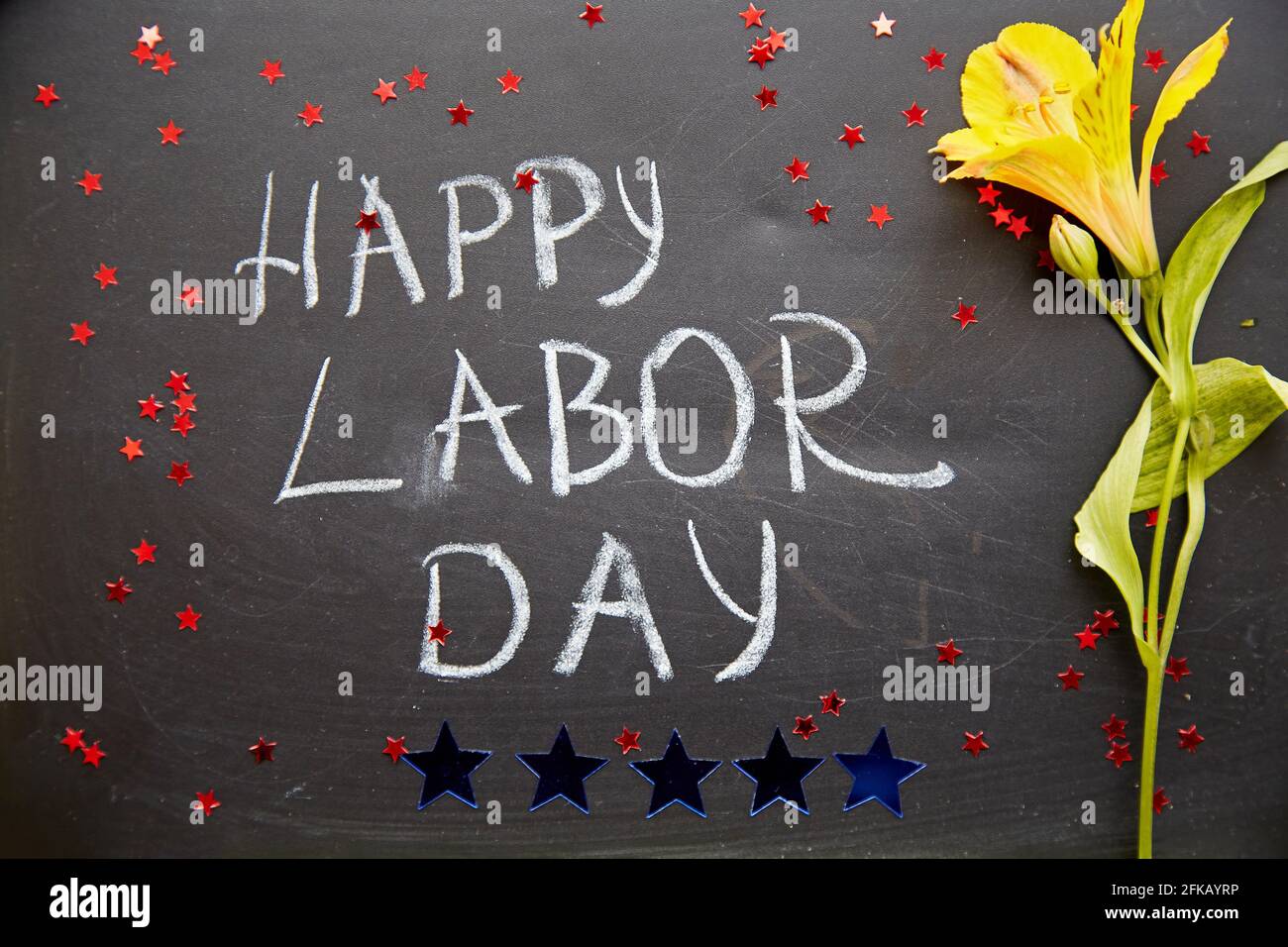 Labor day international worker's day concept. Festive text in American style with alstroemeria flower. High quality photo. High quality photo Stock Photo