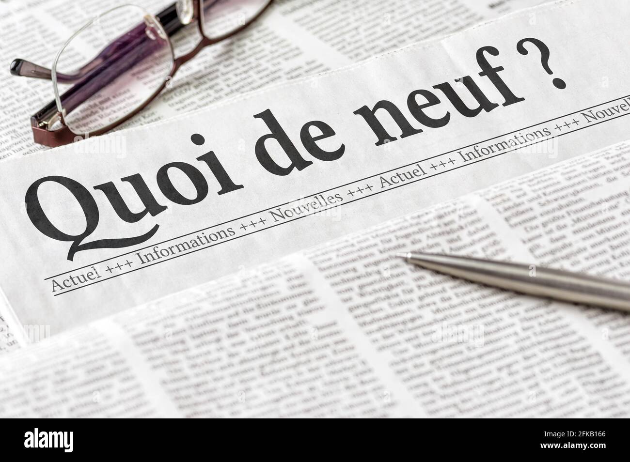 A newspaper with the headline What is new in french Quoi de neuf