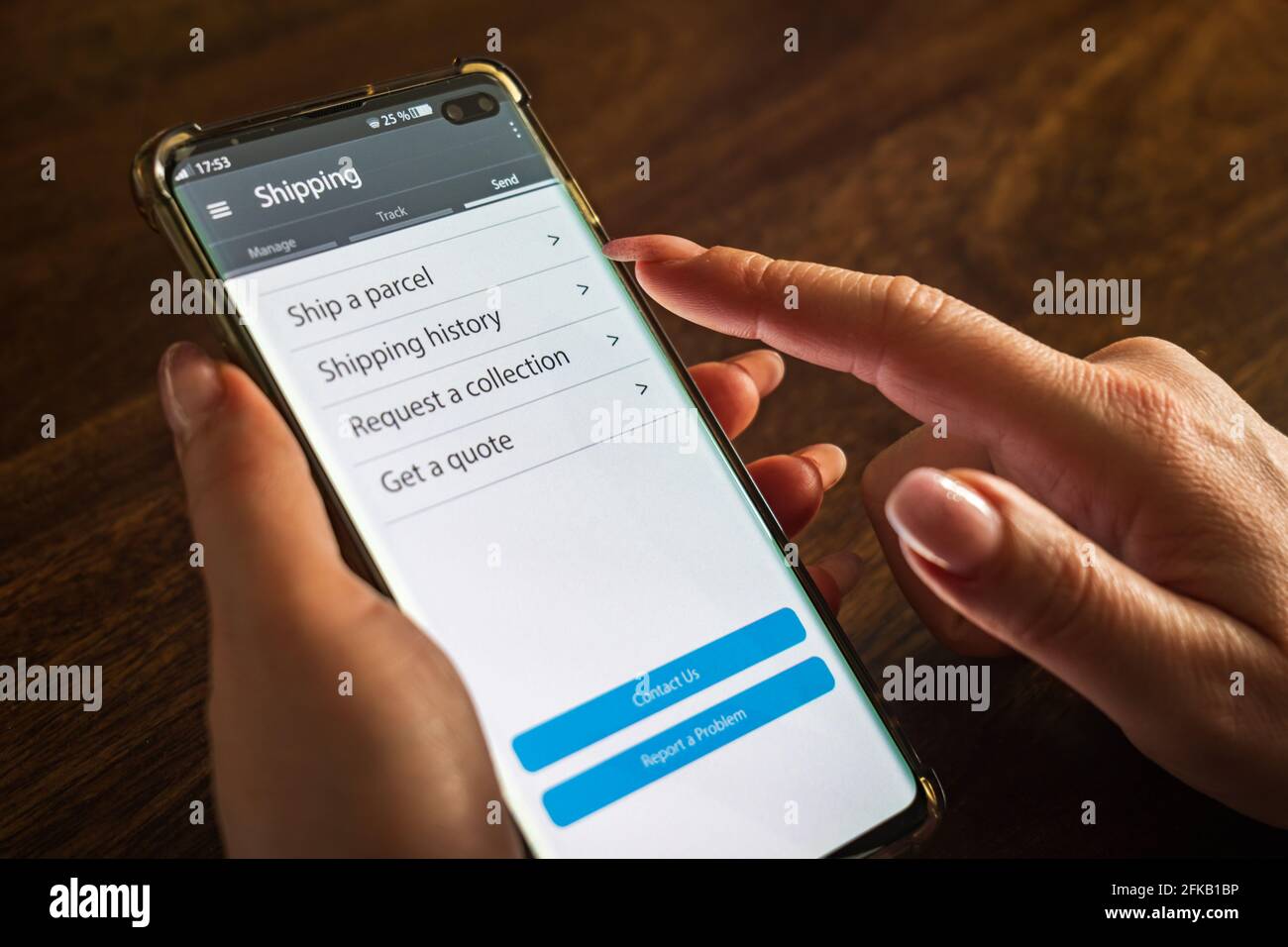 Male thumb finger over parcel delivery app on smartphone screen Stock ...
