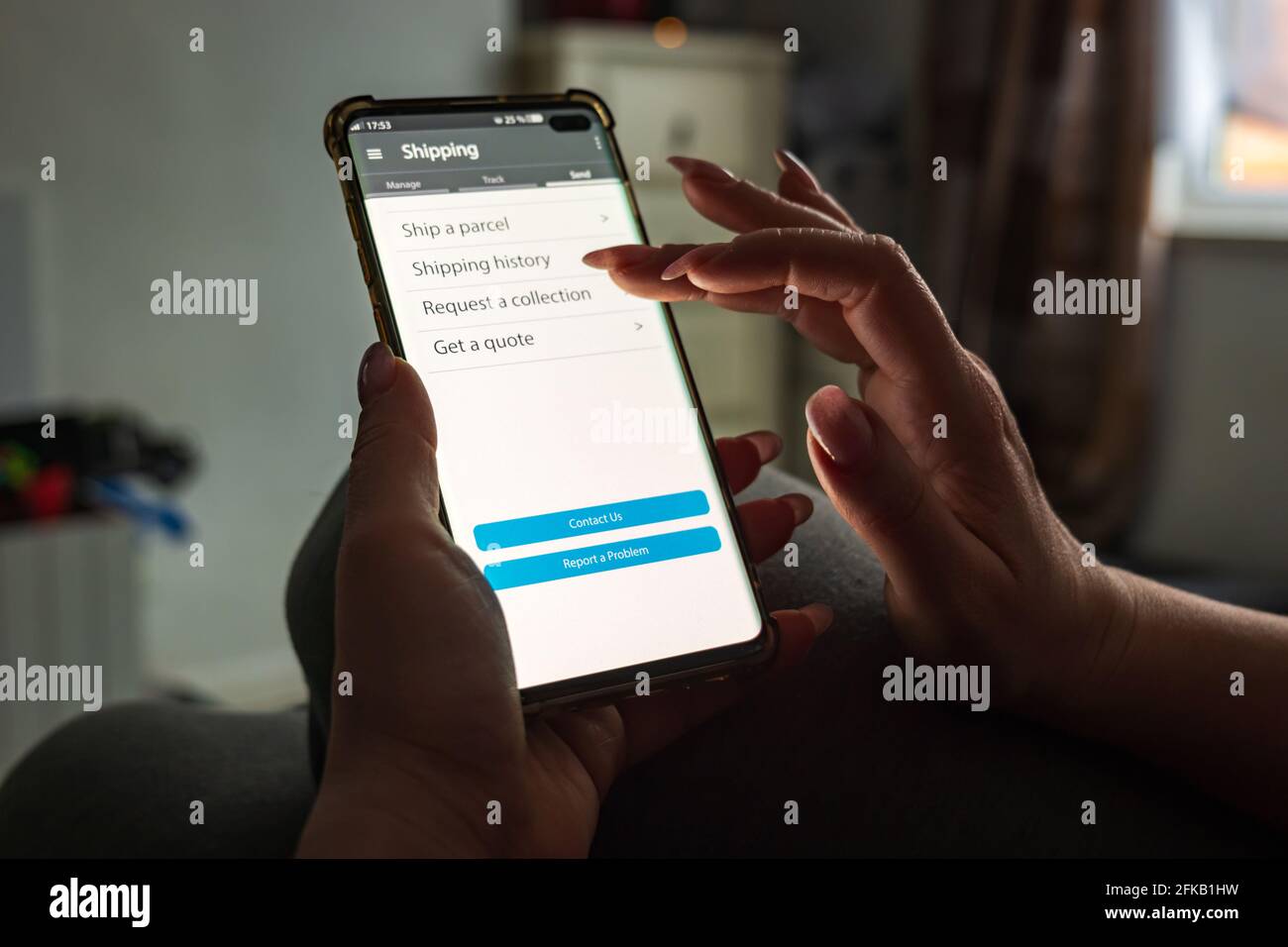 Male thumb finger over parcel delivery app on smartphone screen Stock ...