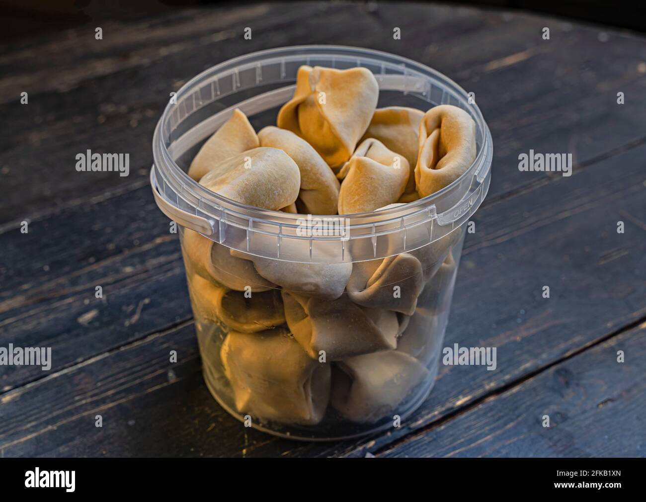 Frozen russian crude pelmen or dumplings in plastic packaging Stock