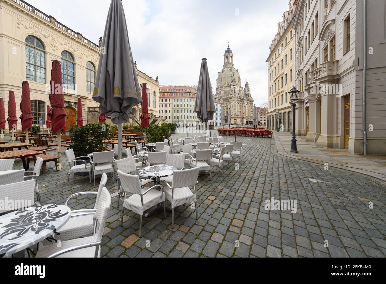 30 April 2021, Saxony, Dresden: Outdoor seats of restaurants are set up on the Neumarkt in front of the Frauenkirche. Photo: Robert Michael/dpa-Zentralbild/dpa Stock Photo
