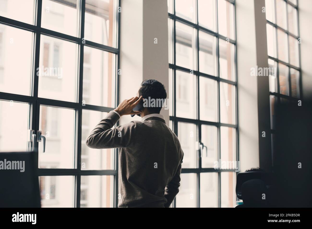 Talking on the phone rear view hi-res stock photography and images - Alamy