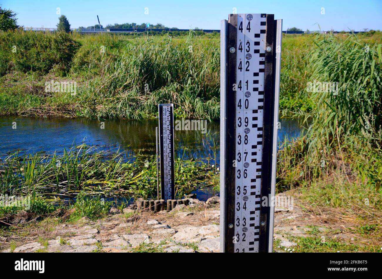 Small river, natural landscape in Lower Silesia, Poland. Beautiful summer with blue sky. Stock Photo