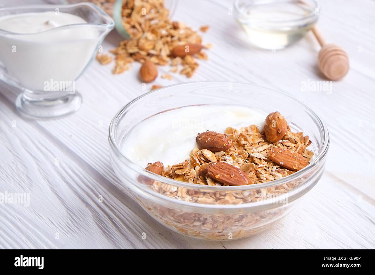 Glass bowl with Greek yogurt and mixed nuts. Healthy sports vegetarian