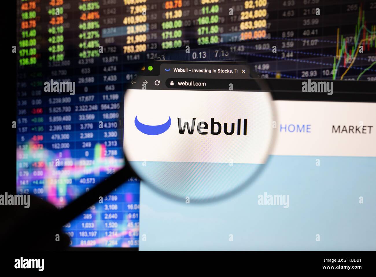 Webull company logo on a website with blurry stock market developments in  the background, seen on a computer screen through a magnifying glass Stock  Photo - Alamy
