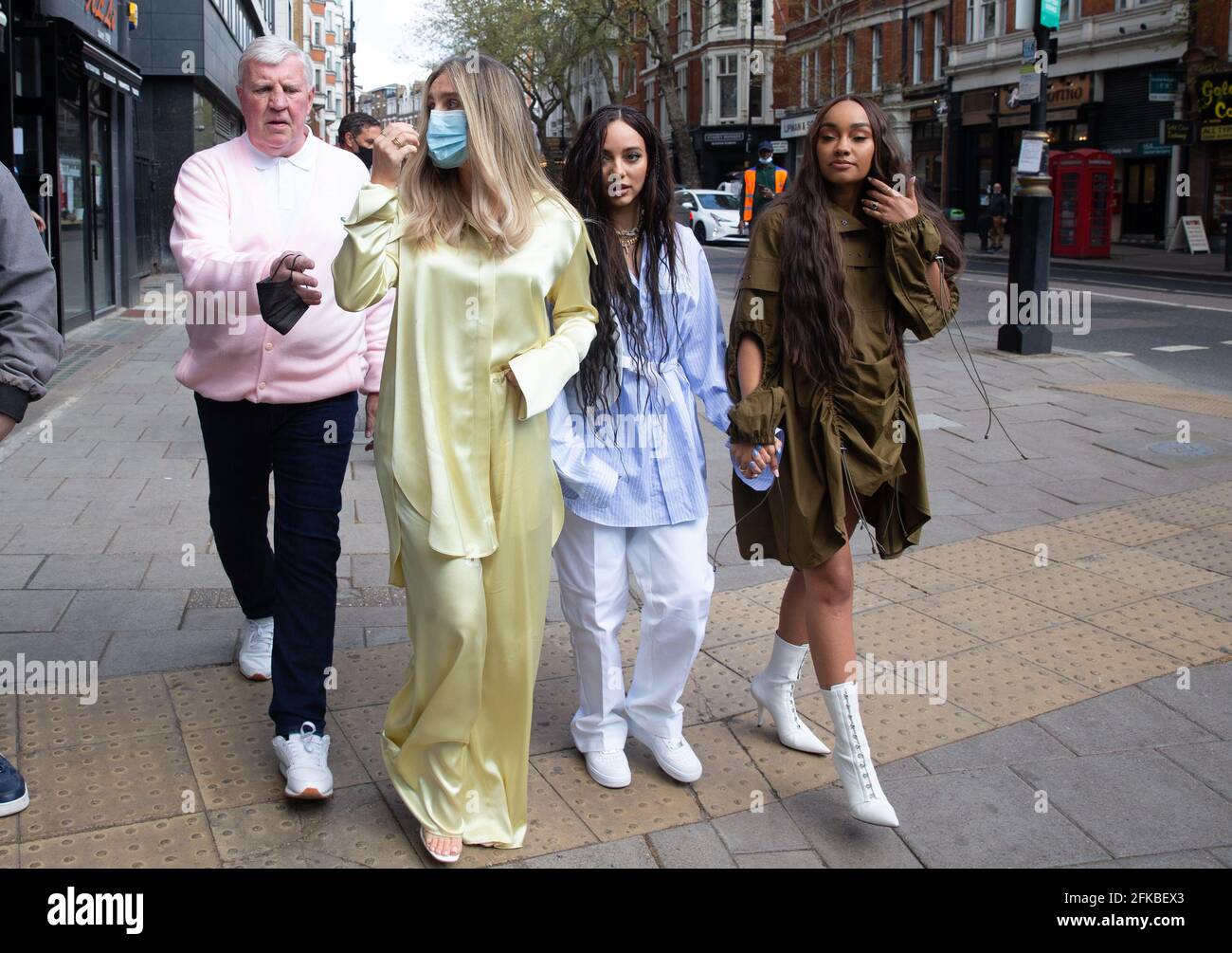 London, UK. 30th April 2021. Little Mix, Perrie Edwards, Jade Thirlwall and Leigh-Anne Pinnock, leave the studios of Global Radio in Leicester Square. Credit: Tommy London/Alamy Live News Stock Photo