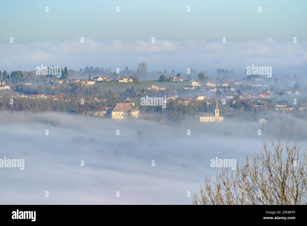 Beautiful aerial view of a town covered in mist, fog. Stock Photo