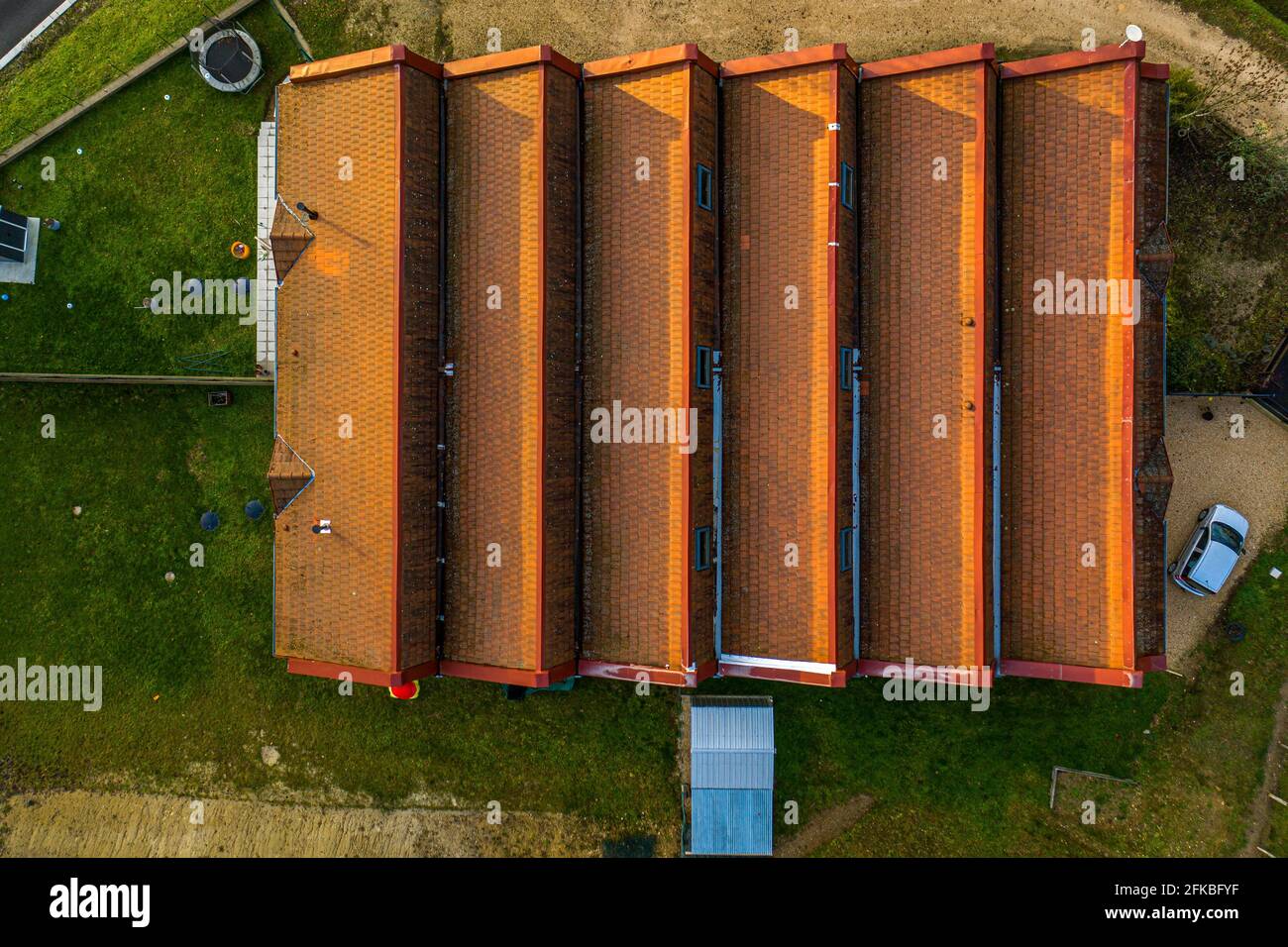 Beautiful top down shot of a building's roof construcuted in a symmetrical pattern. Stock Photo