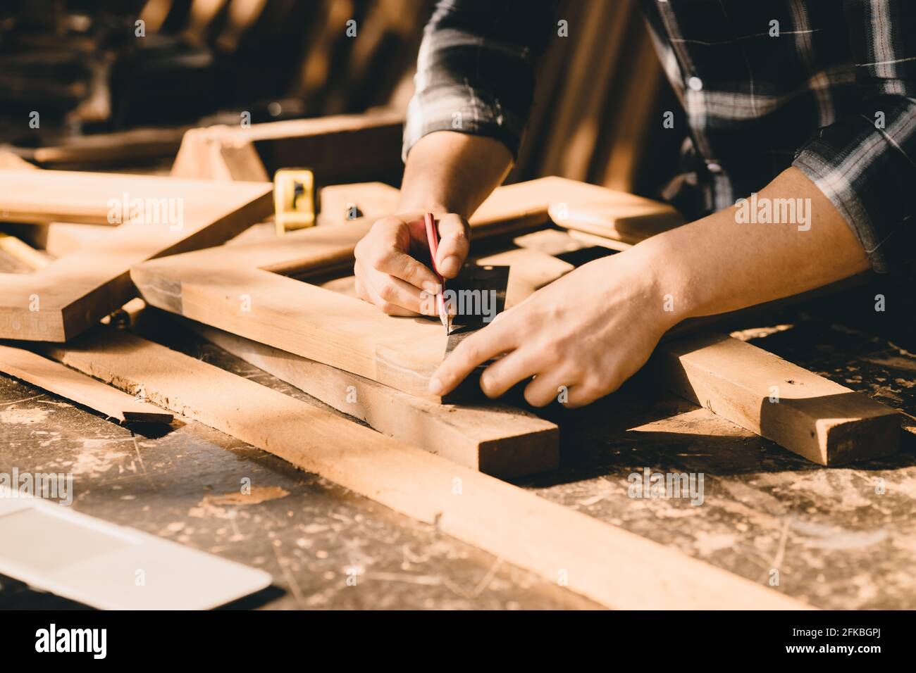 The carpenters high experienced wood worker making furniture. master of