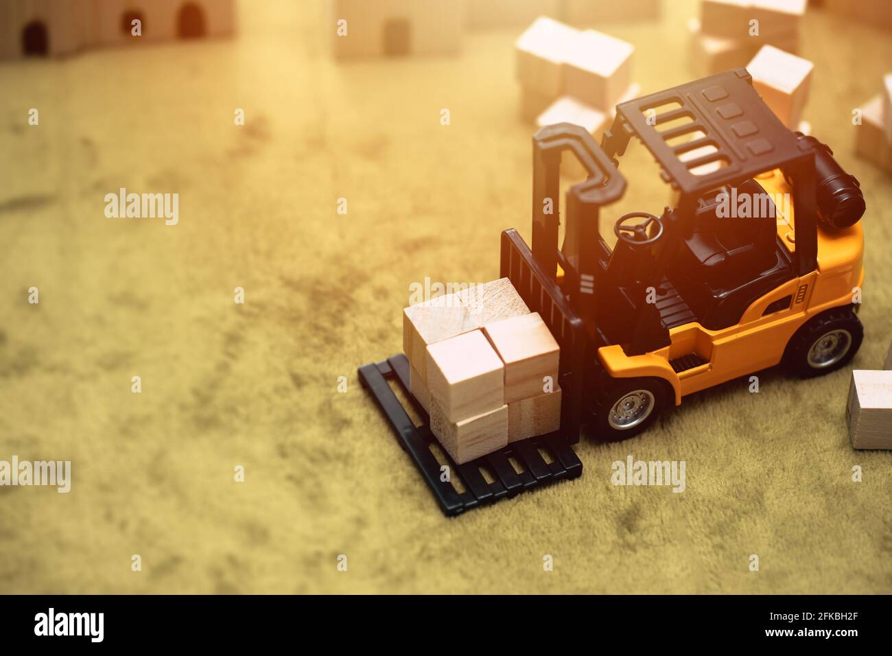 small model of forklift car working moving goods cargo for transport shipping and inventory business industry background concept Stock Photo