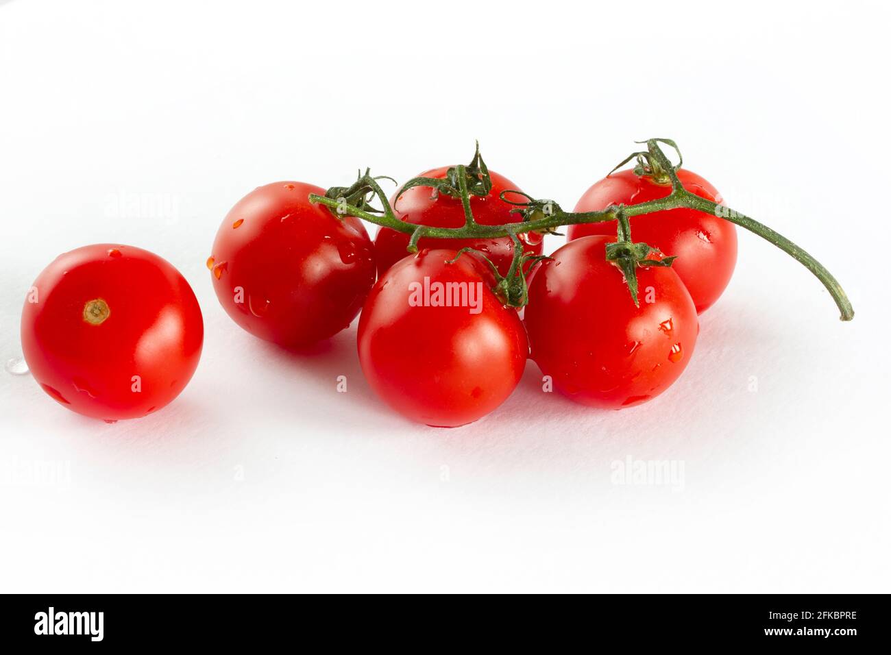 cherry tomatoes on a white background Stock Photo - Alamy