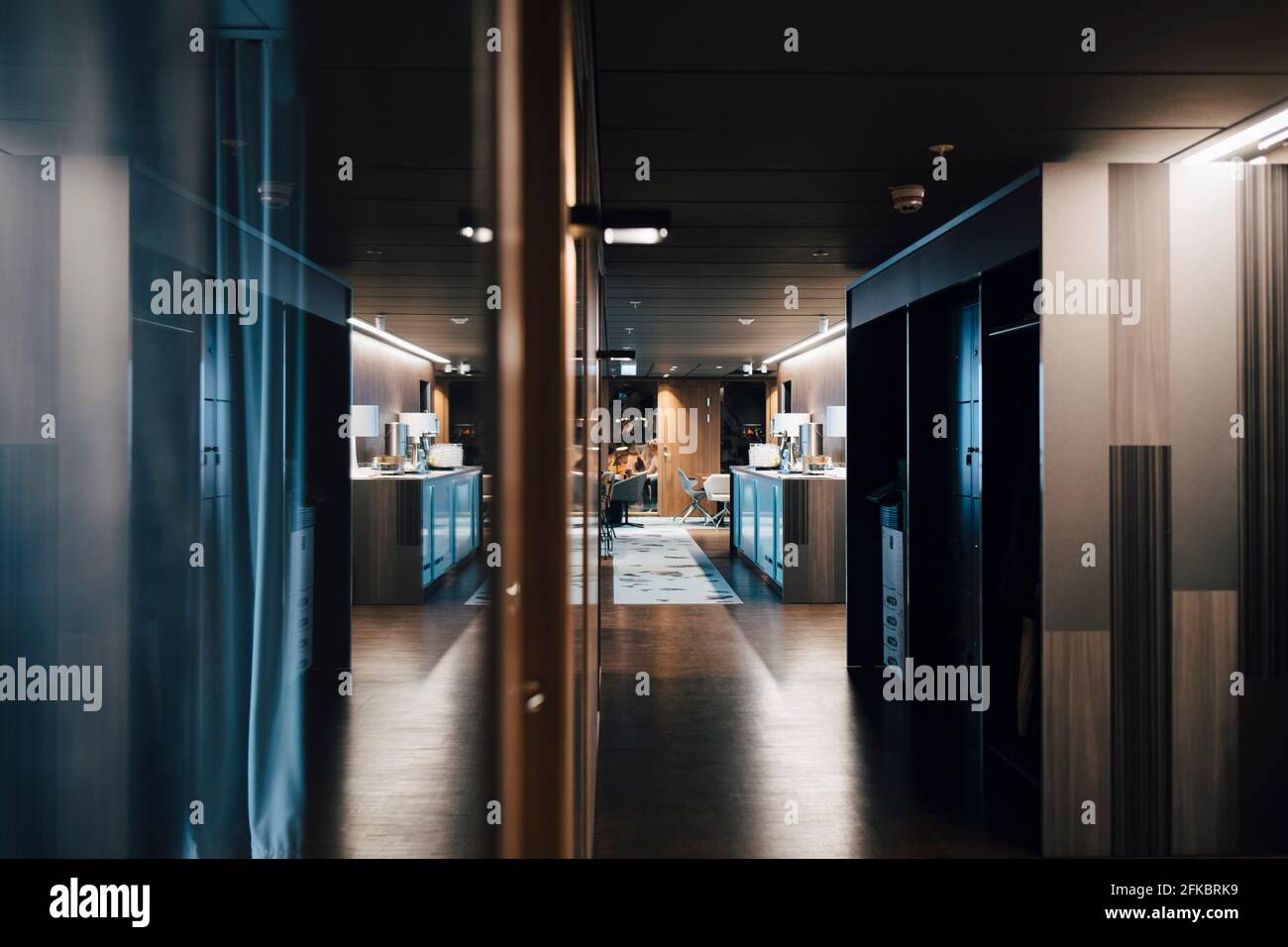 Illuminated corridor in corporate office Stock Photo