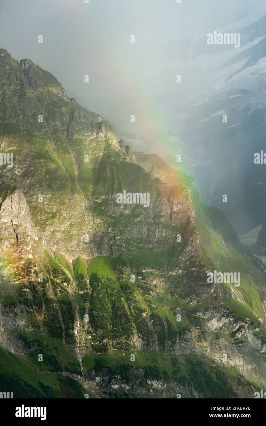 Rainbow over the majestic Wetterhorn mountain in summer, aerial view, Grindelwald, Bernese Alps, Canton of Bern, Switzerland, Europe Stock Photo