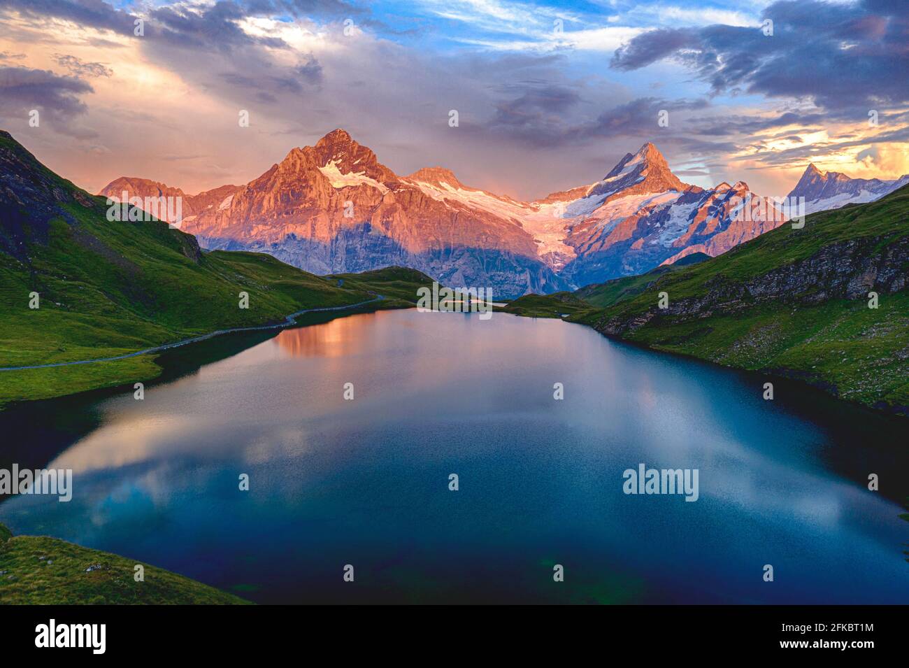 Wetterhorn, Schreckhorn and Finsteraarhorn at sunset from Bachalpsee lake, Grindelwald, Bernese Oberland, Switzerland, Europe Stock Photo