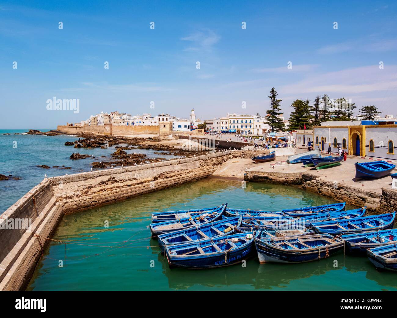 Cityscape with blue boats in the Scala Harbour and the Medina city walls, Essaouira, Marrakesh-Safi Region, Morocco, North Africa, Africa Stock Photo