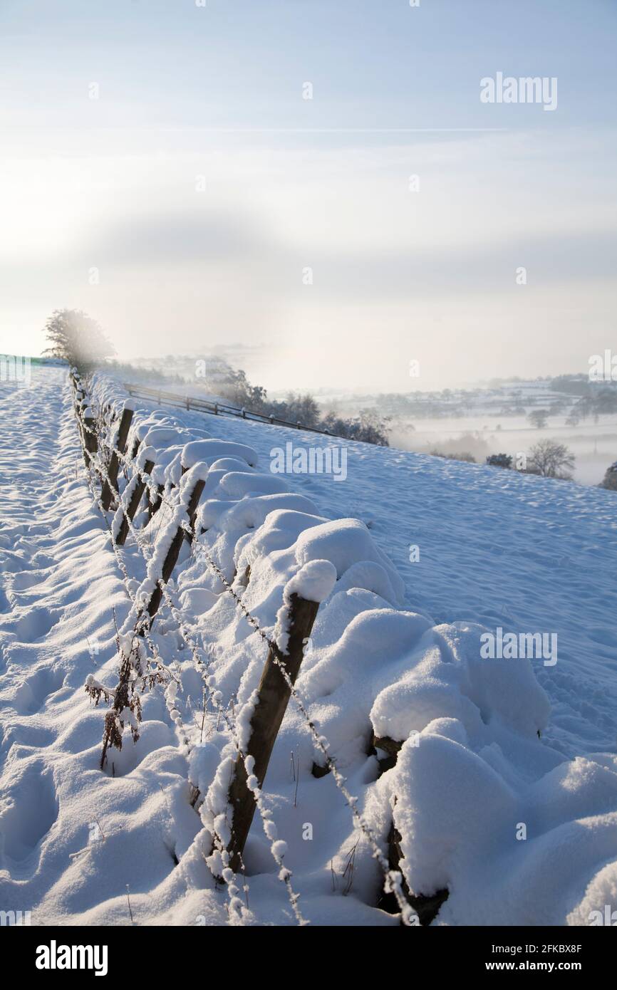 Snow covered dry stone wall, near Almscliff Crag, Wharfe Valley, North Yorkshire, England, United Kingdom, Europe Stock Photo