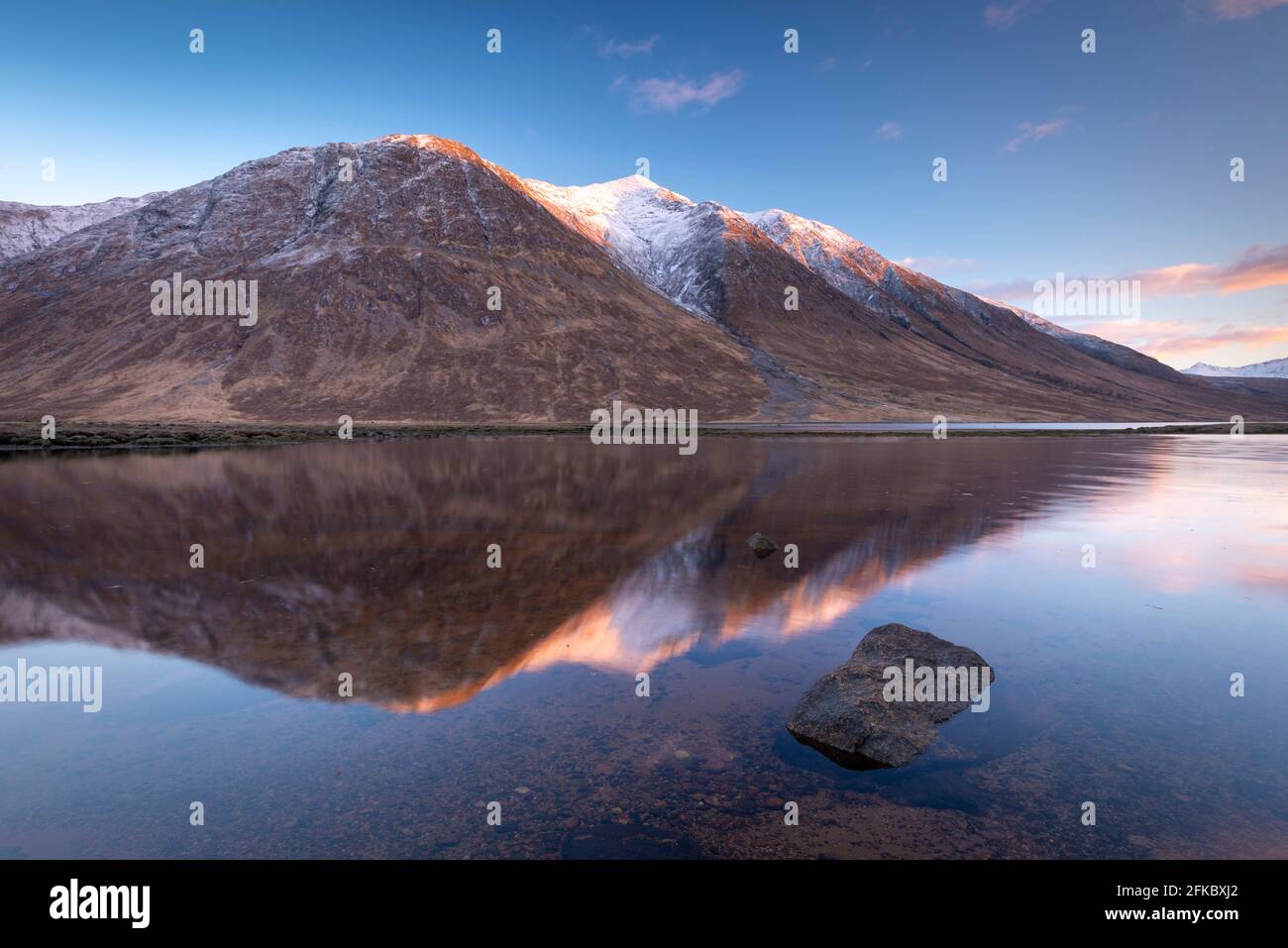 Snow capped Highlands mountains reflected in the calm waters of Loch Etive in winter, Highlands, Scotland, United Kingdom, Europe Stock Photo