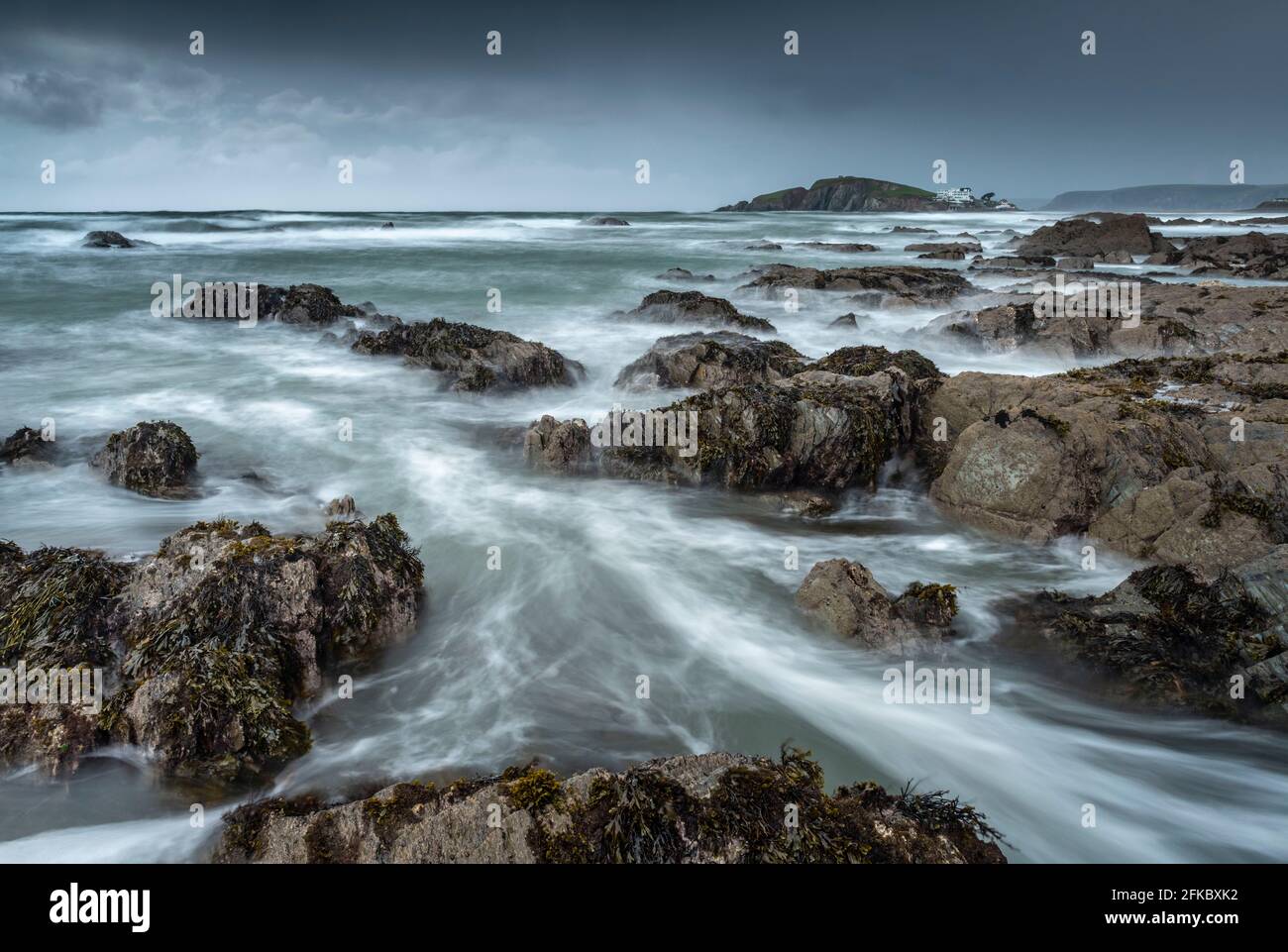 Stormy conditions on the rocky Bantham coast, looking across to Burgh Island, Devon, England, United Kingdom, Europe Stock Photo