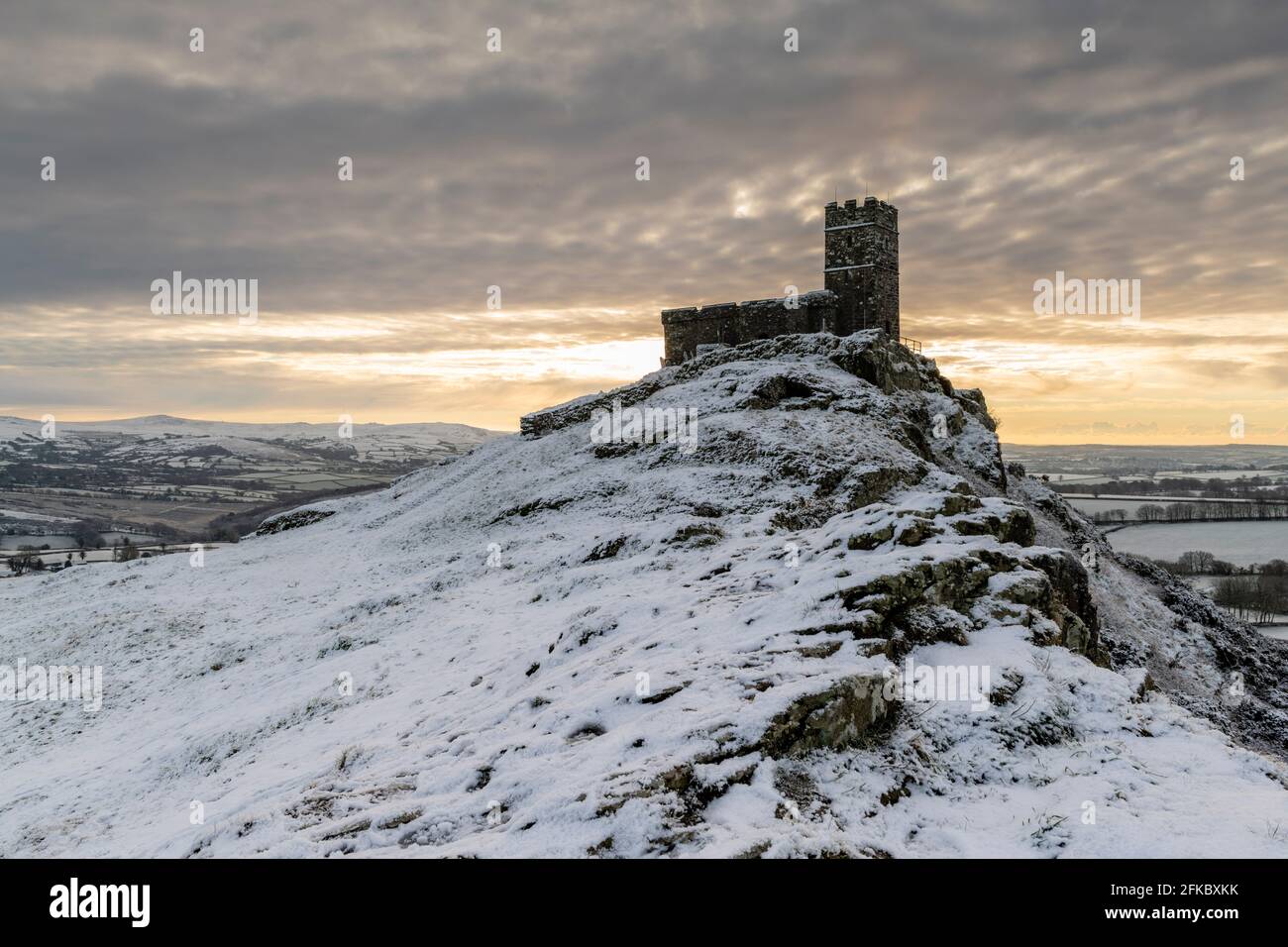 Brentor Church on a snowy outcrop on a winter morning, Dartmoor, Devon, England, United Kingdom, Europe Stock Photo
