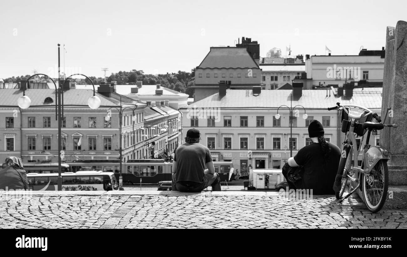 Helsinki, Finland - July 26, 2017: Senate Square in Helsinki and resting people on the stairs. Black and white photography Stock Photo