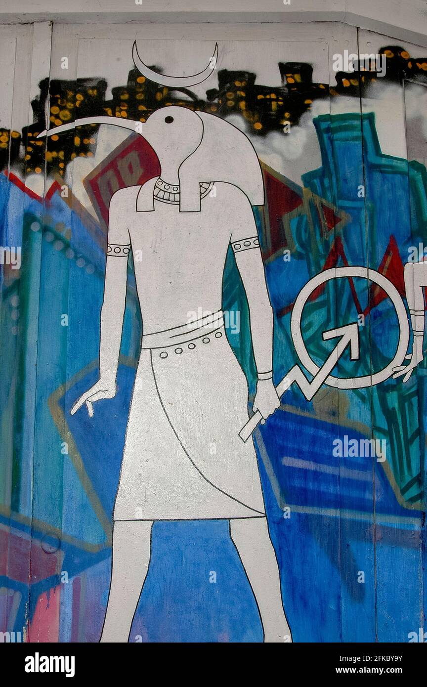 Thoth, ancient Egyptian god of wisdom, writing and science, represented as a man with the head of an ibis.  Street art in Spuistraat, Amsterdam, North Holland, Netherlands.  Although the homeless people, artists and musicians who occupied empty properties here for years are now long gone, the Spuistraat area still draws new generations of sightseers keen to enjoy the striking urban artworks they left behind. Stock Photo