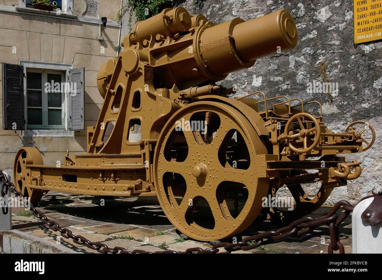 A rare surviving example of the concrete-piercing Škoda 30.5 cm Mörser M.11 heavy siege howitzers used by Austria-Hungary on its Italian and eastern fronts in World War I, and also by Nazi Germany in World War II, stands outside the Museo Storico Italiano della Guerra (Italian War History Museum) at Rovereto, Trentino-Alto Adige, Italy.  It fired 305 mm (12 ins) shells that could penetrate reinforced concrete up to 2 m thick, blow a crater 8 m (26 ft) wide and deep and kill enemy soldiers up to 400 m (1,312 ft) from the blast. Stock Photo