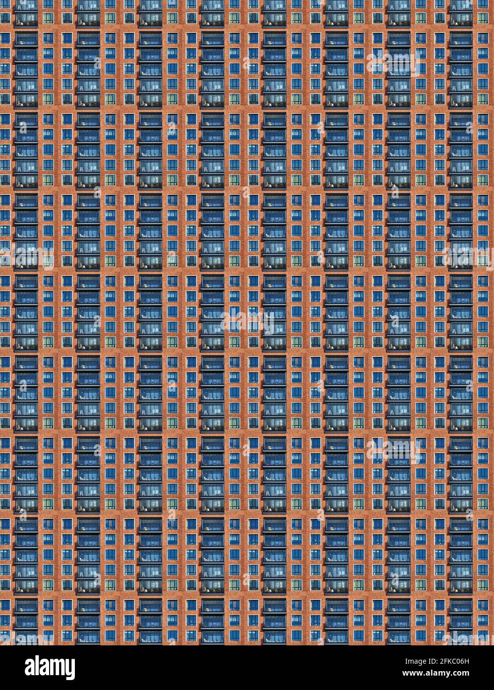 Repeated pattern of windows in monotonous skyscraper, abstract composite pattern and texture Stock Photo