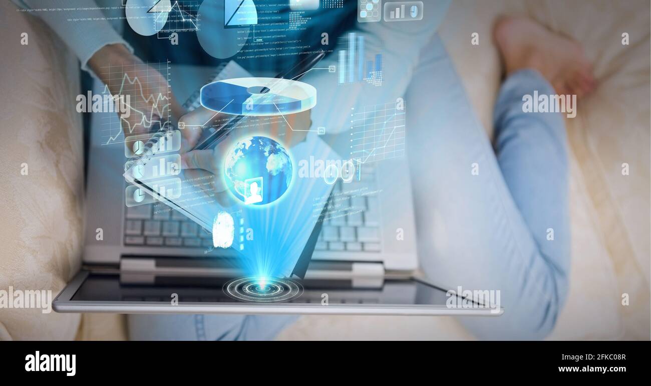 Composition of screen with data processing over woman sitting on sofa using laptop Stock Photo