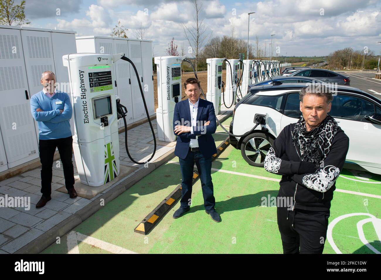 EDITORIAL USE ONLY Ken McMeikan, Moto CEO, Toddington Harper, Founder and CEO of GRIDSERVE and Dale Vince, CEO of Ecotricity at the launch of the UK's largest high power motorway electric vehicle charging site, which features 24 high-powered 350kW EV chargers provided by GRIDSERVE, Ecotricity and Tesla at Moto's new Rugby Services. Picture date: Friday April 30, 2021. Stock Photo