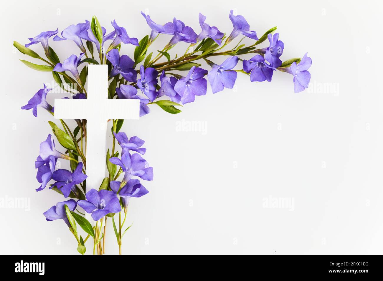 The Christianity cross of beautiful blue periwinkle flower. Baptism