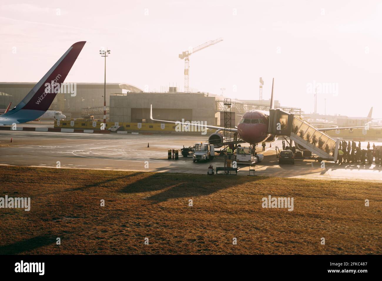 An airport with planes at the sunset Stock Photo - Alamy