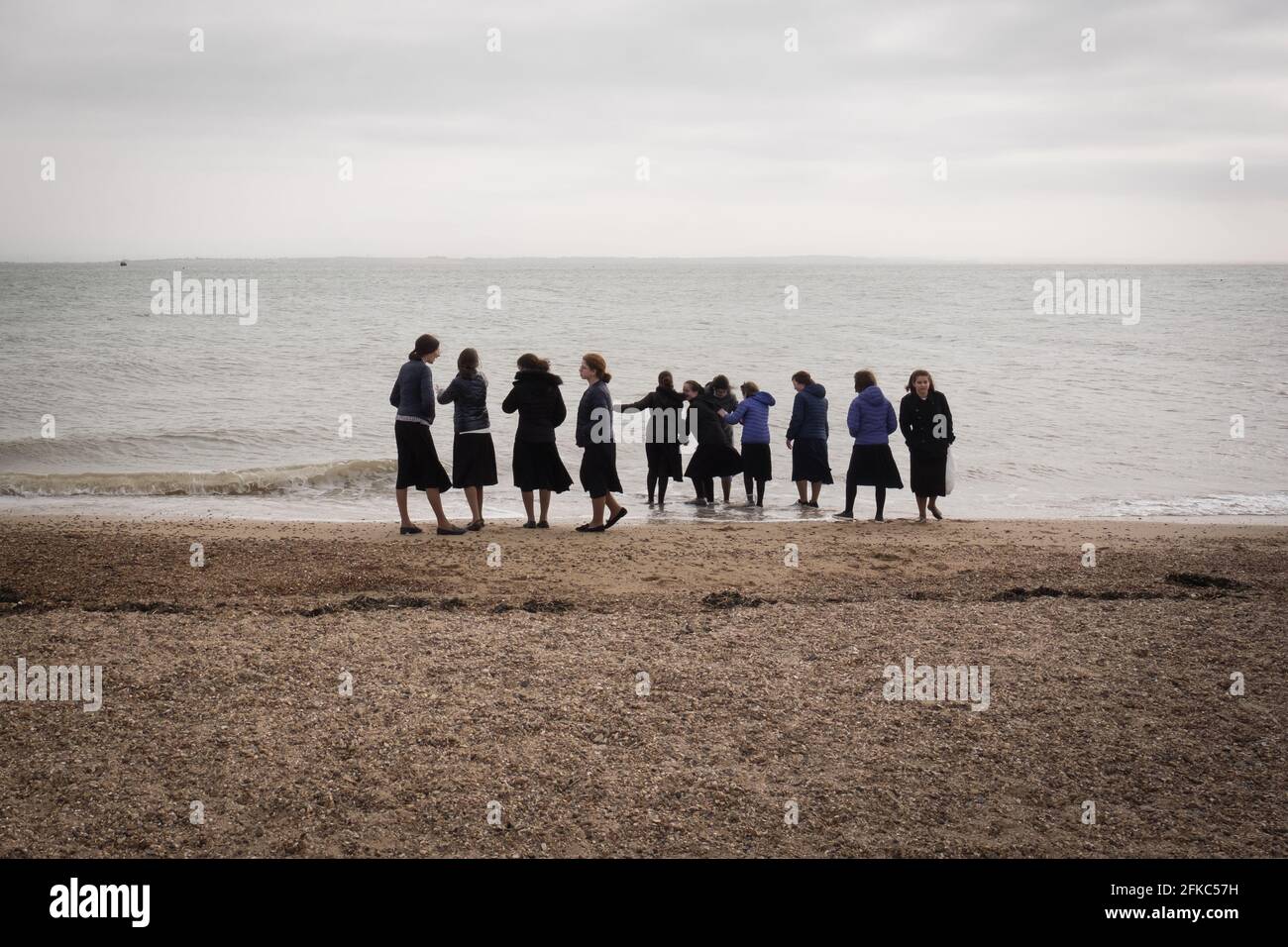 Orthodox Jews spend a day on the sea front at Southend-on-Sea, Essex, during the religious holiday of Pesach (Passover). The eight-day Jewish holiday commemorates the emancipation of the Israelites from slavery in ancient Egypt. The first two days and last two days of Passover are holidays during which Jews don't work drive, write, or switch on or off electric devices. The middle four days, called Chol Hamoed, are semi-festive days when most forms of work are permitted, allowing travel for family days out. The rising house prices in their traditional home of Stamford Hill, North London, has fo Stock Photo