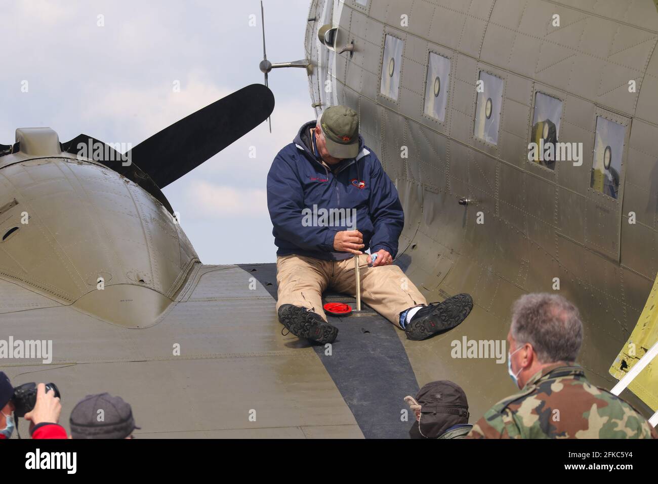 Dipping the tank. Dipstick checking of fuel levels in the fuel tank. World War 2 C-47 airplane named That's All, Brother. This restored historic aircr Stock Photo